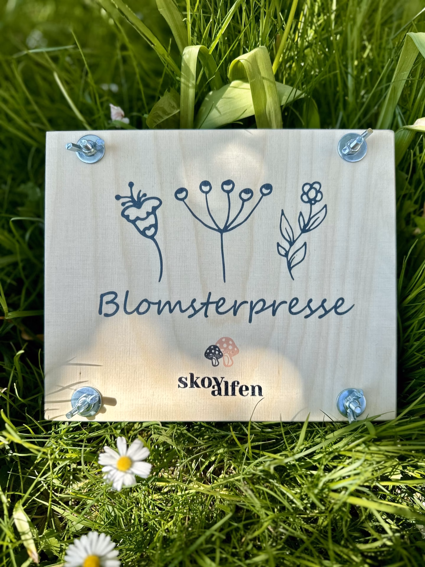 Hvordan presser man blomster uden en blomsterpresser?